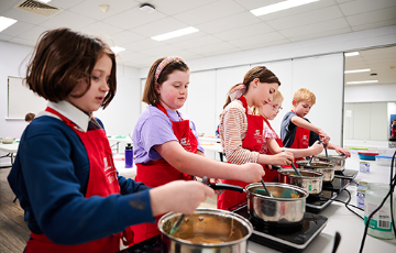 Children enjoying mini chef classes at Stirling Leisure
